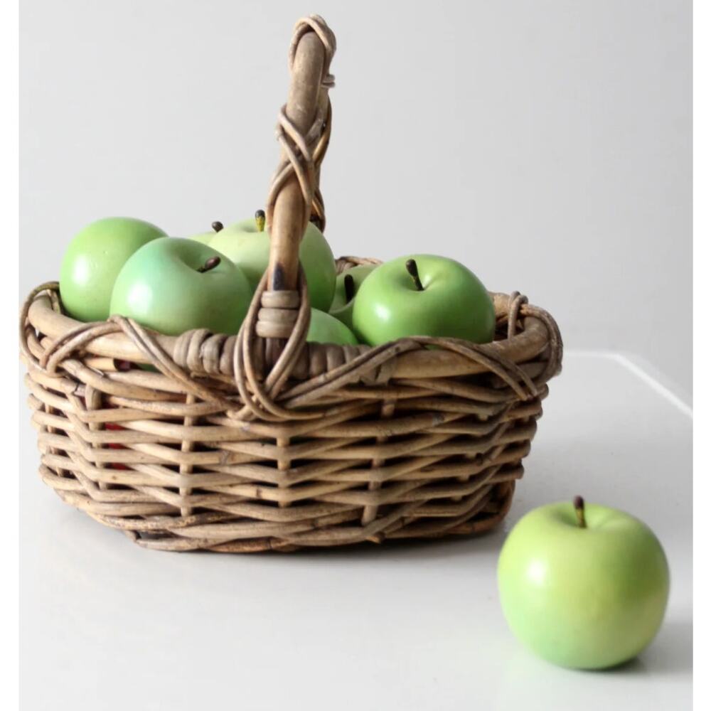 vintage woven gathering basket with a  sculptural twisted handle 14" x11"